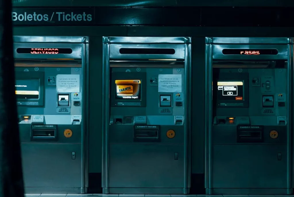 three Ticket Vending Machines in the evening