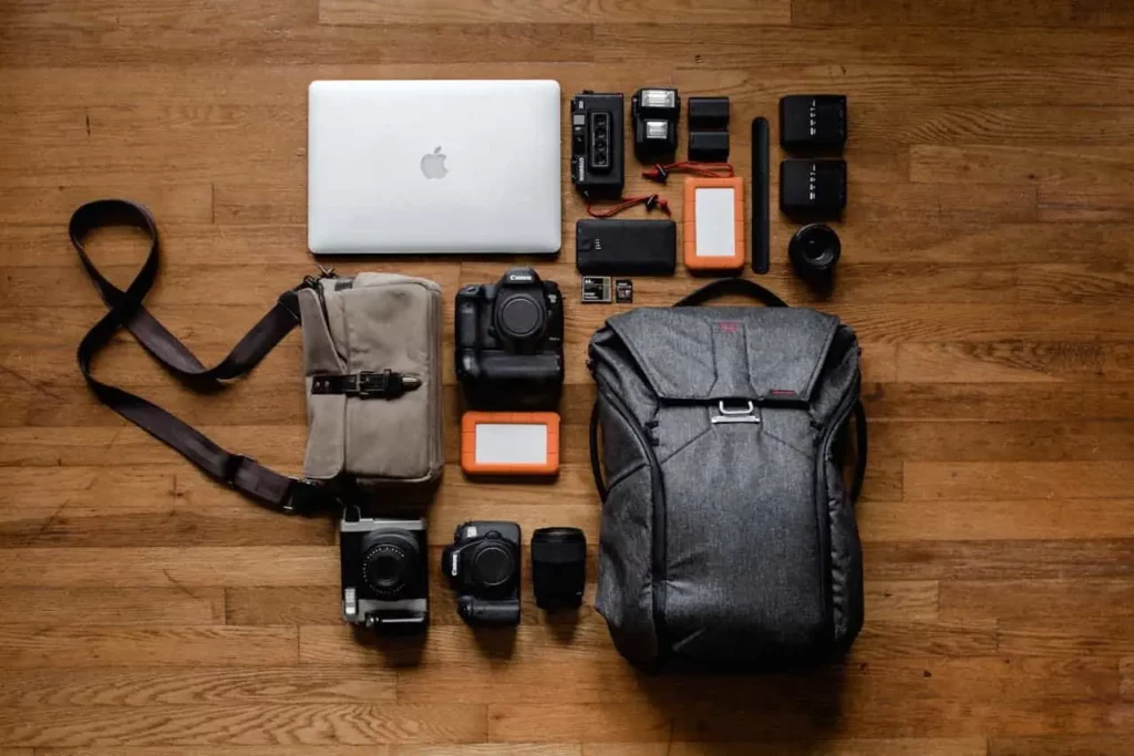 Photographer's travel tech gear, highlighting the importance of insuring expensive equipment before trips